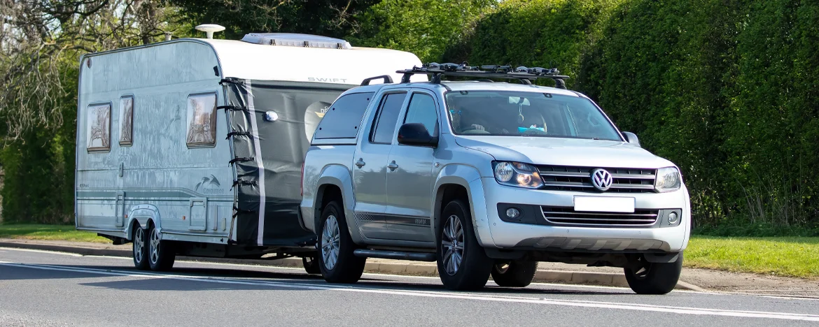 Volkswagen Amarok pick-up towing a caravan