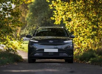 Hyundai Kona Electric under tree